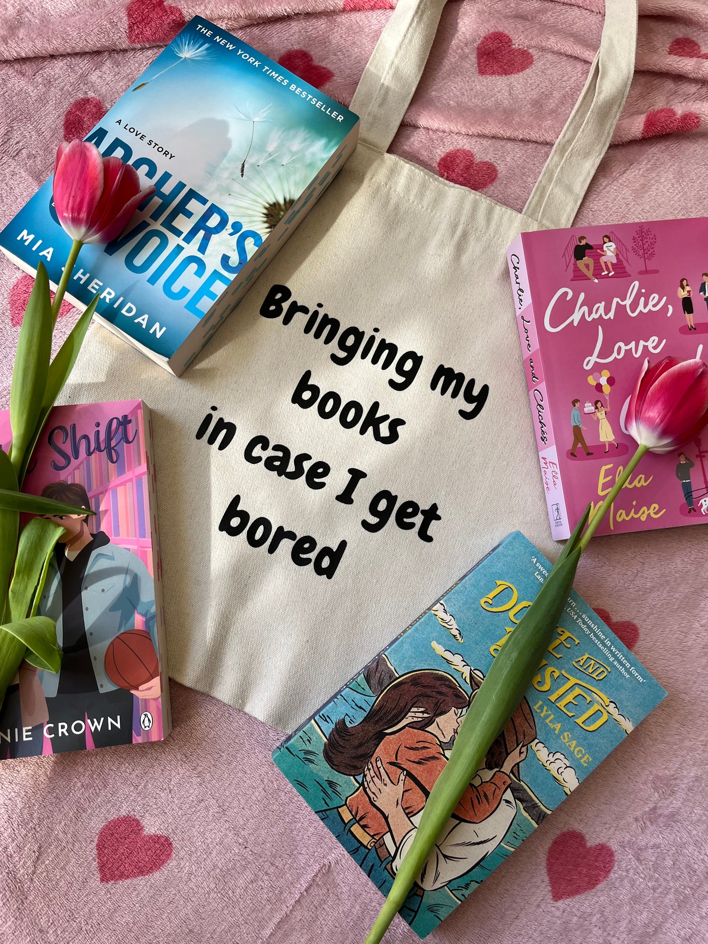 Bringing my books in case I get bored tote bag